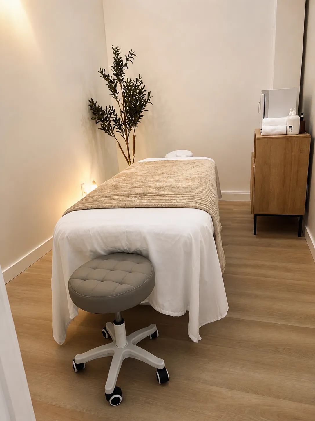 single treatment room at Harbor Wellness with warm candle light