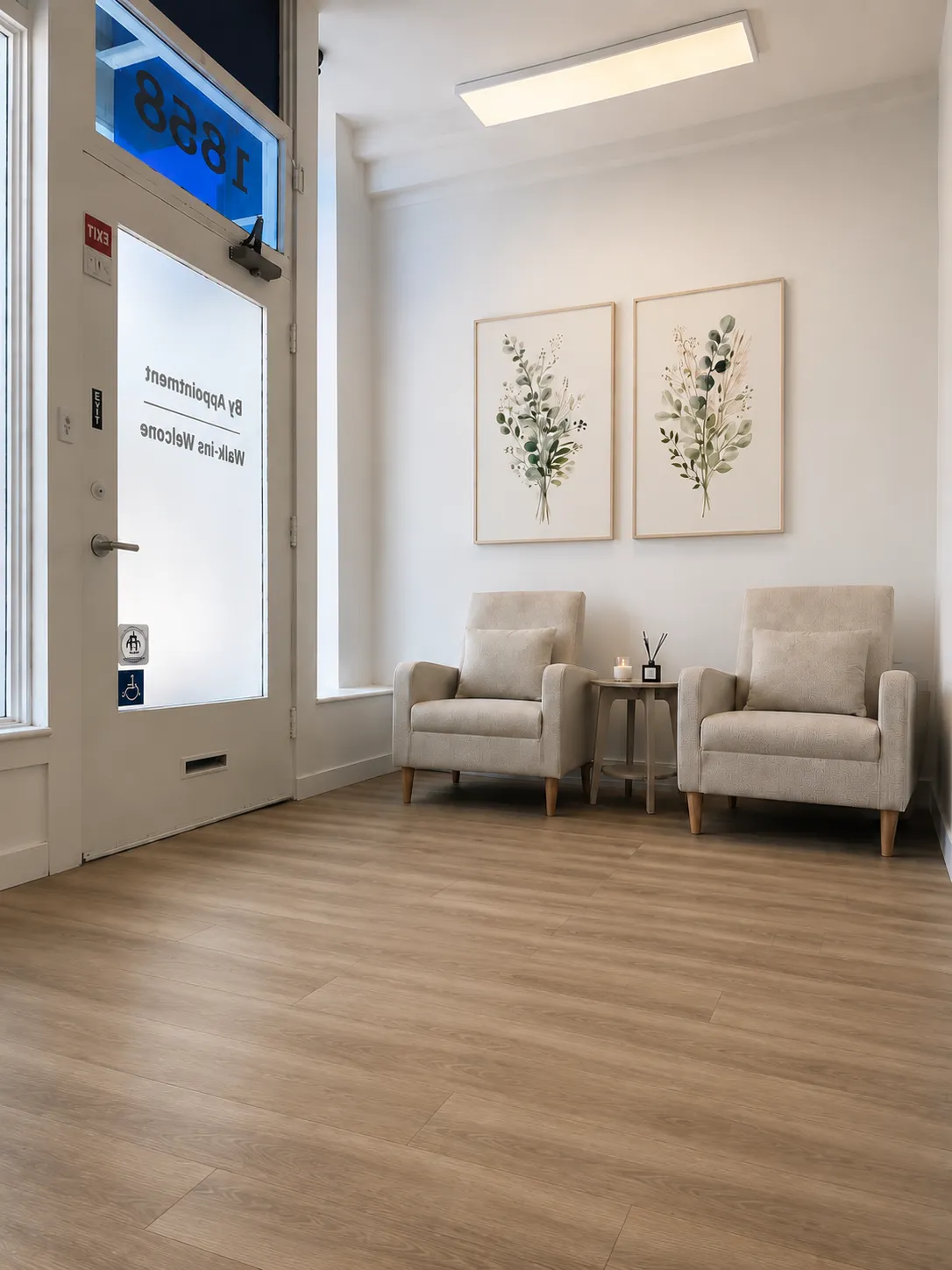 Armchairs and botanical prints in the Harbor Wellness waiting area
